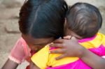 Girl protecting little sister India Bihar