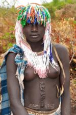 Ethiopia Mursi girl with scarification tattoos