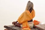 India meditation with face to Ganges