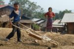 Laos young boy with a barrow