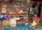 Laos local grocerie store with mother and child